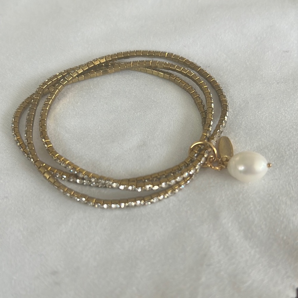 Clear rhinestone and gold bracelet with pearl drop charm